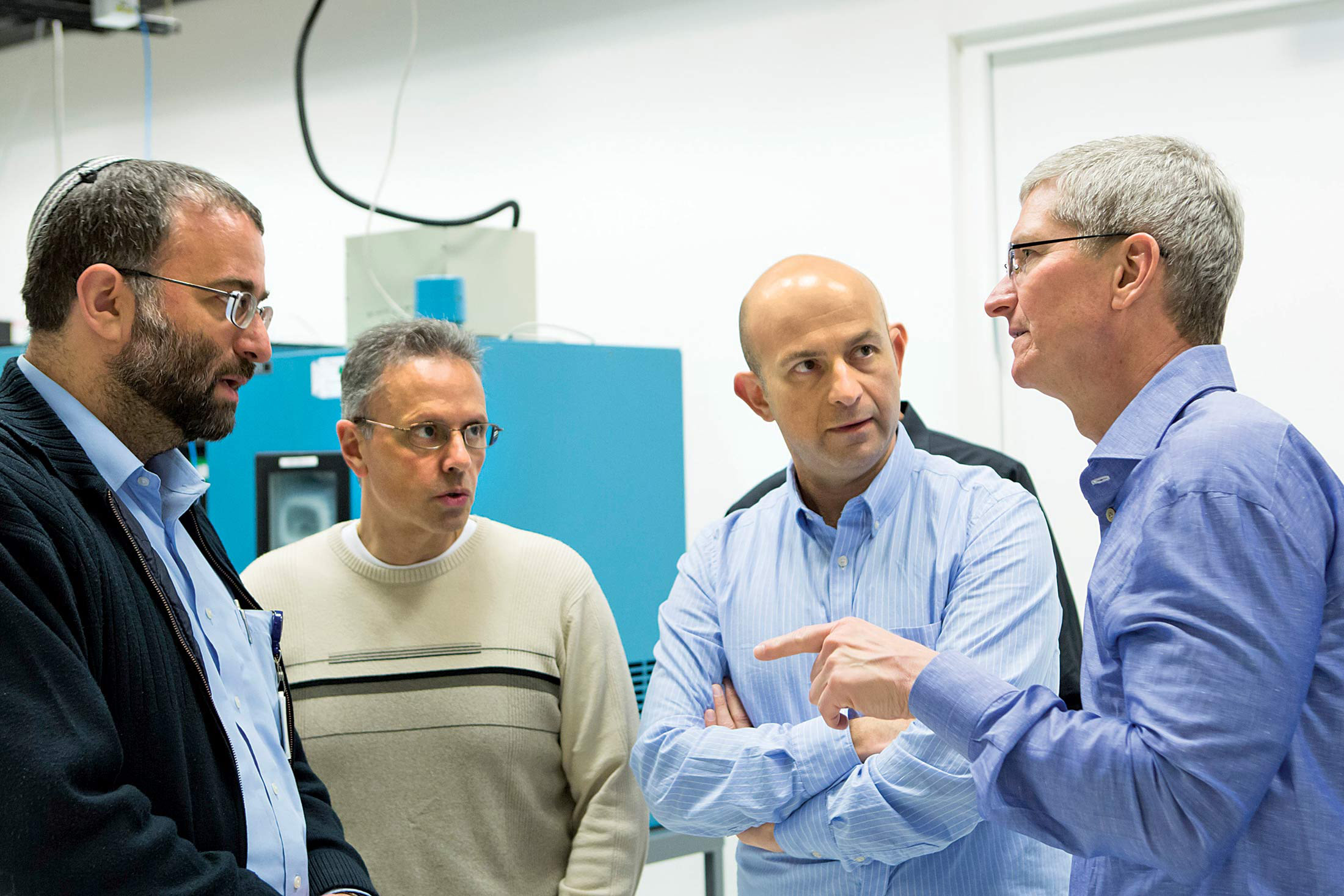 In Israel, Srouji (second from left) and Cook (right) with Apple employees