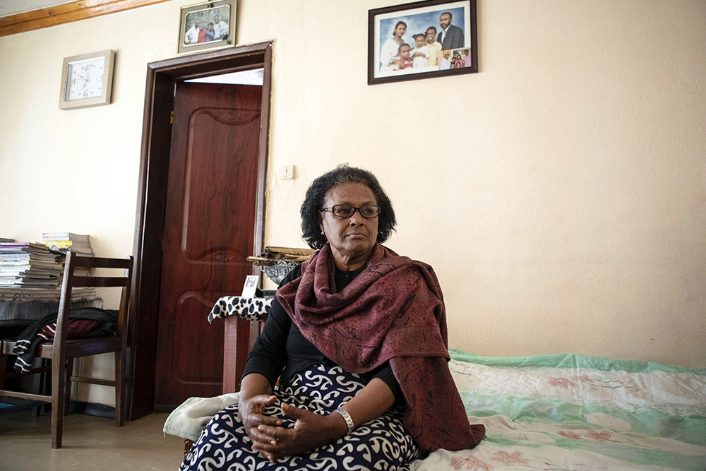 photo of mother sitting on the bed (not sure why this image isn't showing up consistently
